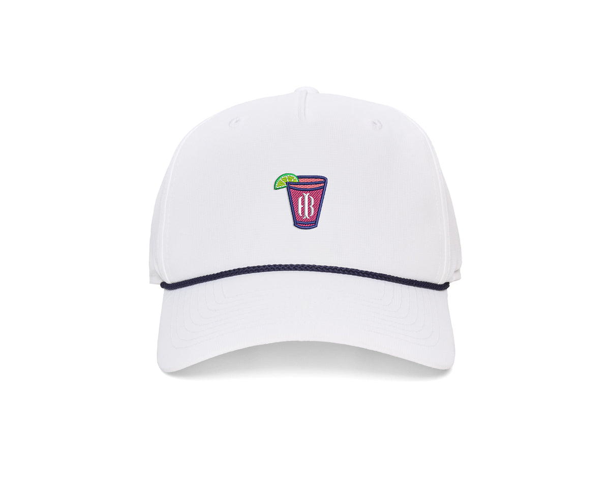 The Performance Rope Hat: White with Transfusion Icon features a navy rope on the bill, embroidered cocktail patch, UPF 50+ protection, and adjustable snap-back.