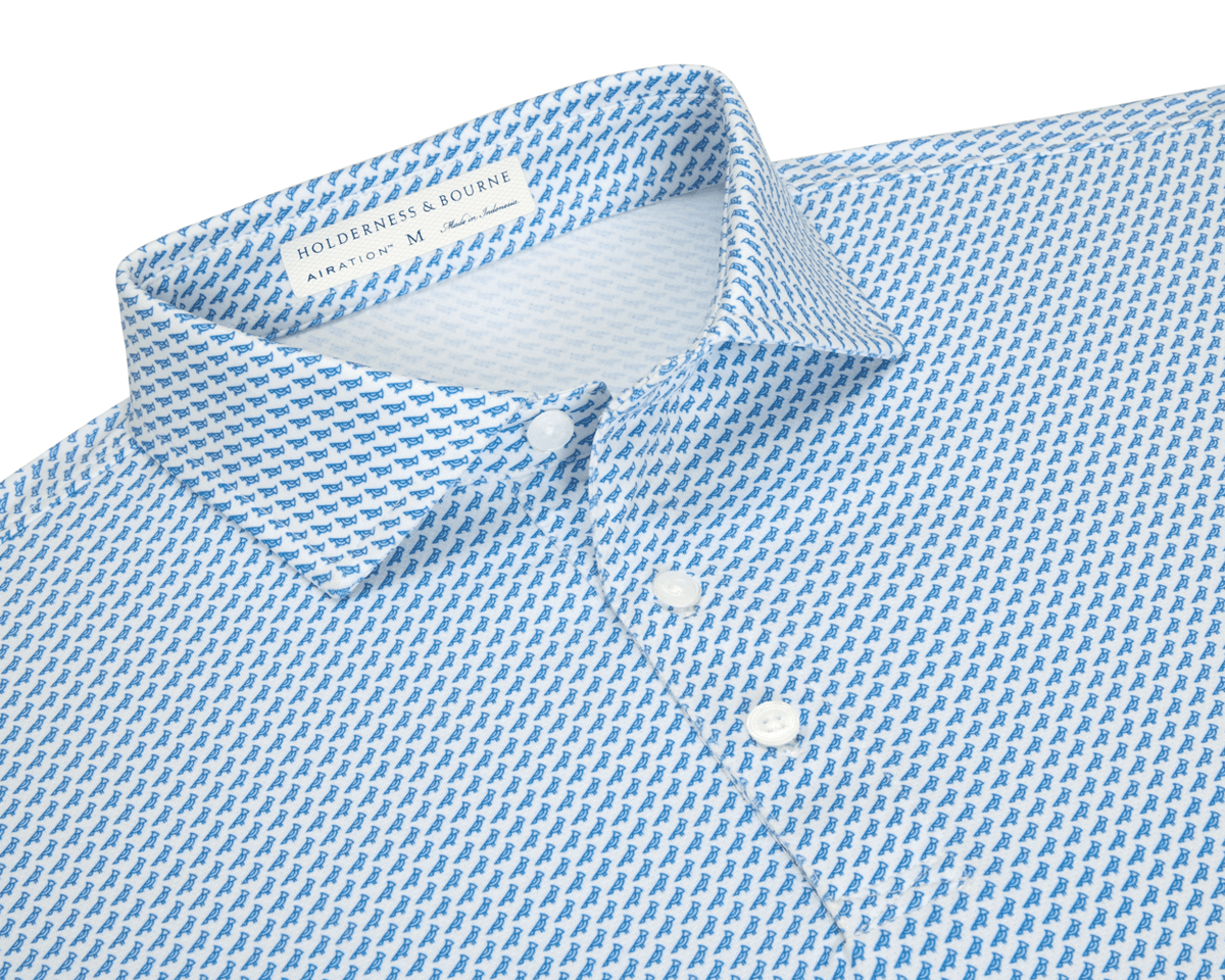 The Walton Shirt: Maidstone Blue, a men's white button-down with blue motif, features a pointed collar, three buttons, and HOLDERNESS & BOURNE label.