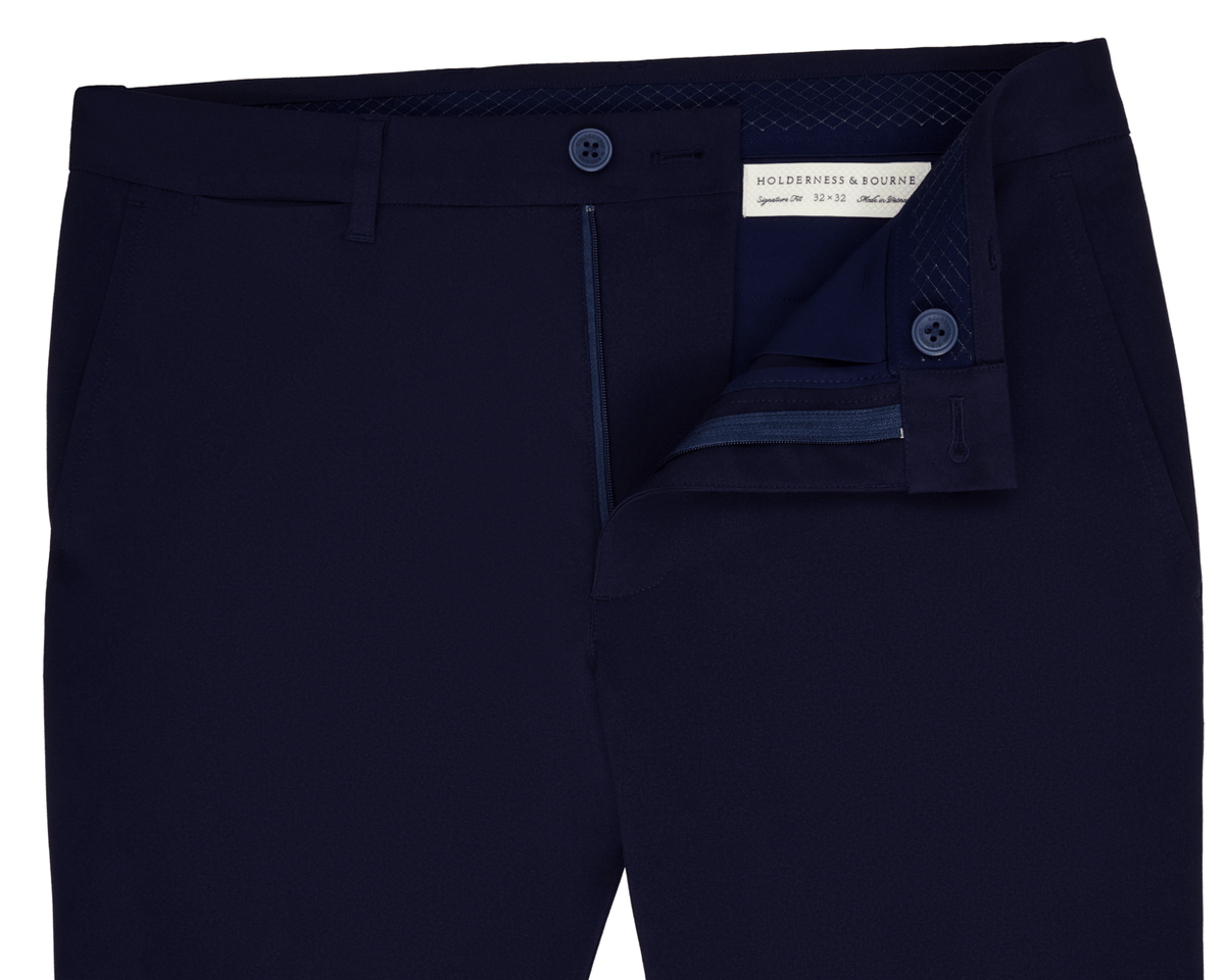 Holderness & Bourne Men’s Navy Dress Pants unbuttoned on white background