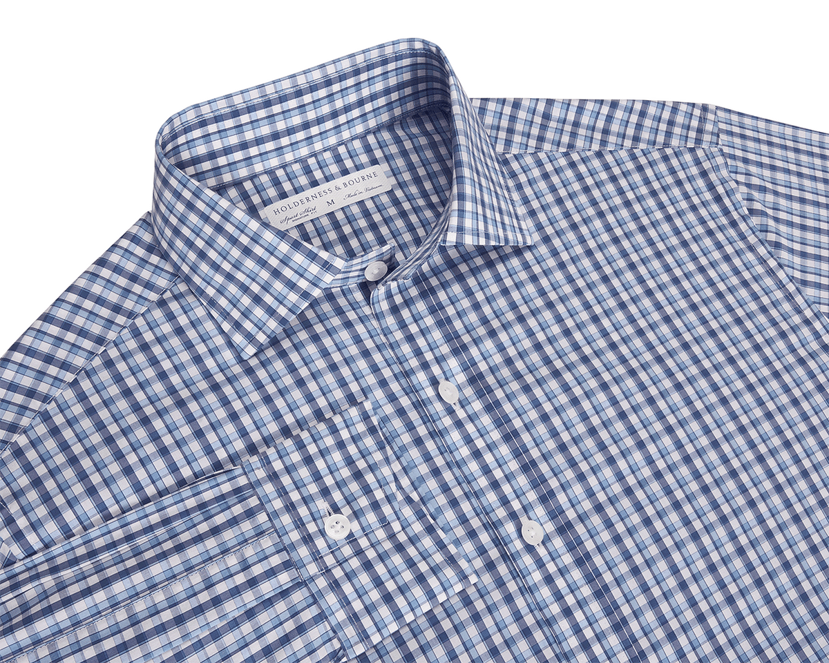 Blue and white checkered button up shirt with a collar on a white background