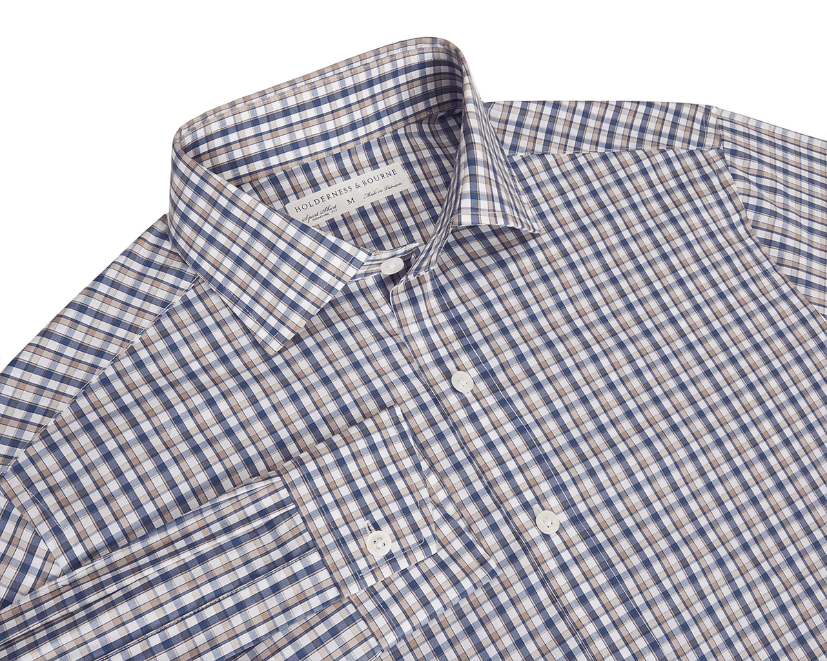 Blue and beige checkered button up shirt with a collar on a white background