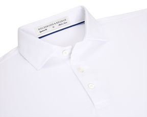The Anderson Shirt: White, short-sleeved polo with structured spread collar, three-button placket, and performance fabric for stretch and moisture wicking. Size M, made in Korea.