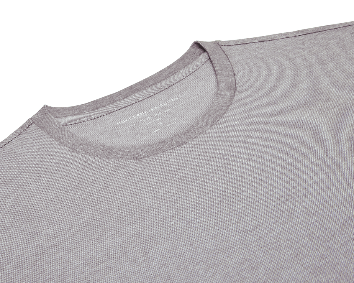The Mason T-Shirt: Heathered Gray, showcasing its crew-neck, light-gray fabric with visible collar and shoulders, highlighting the luxurious Peruvian pima cotton blend.