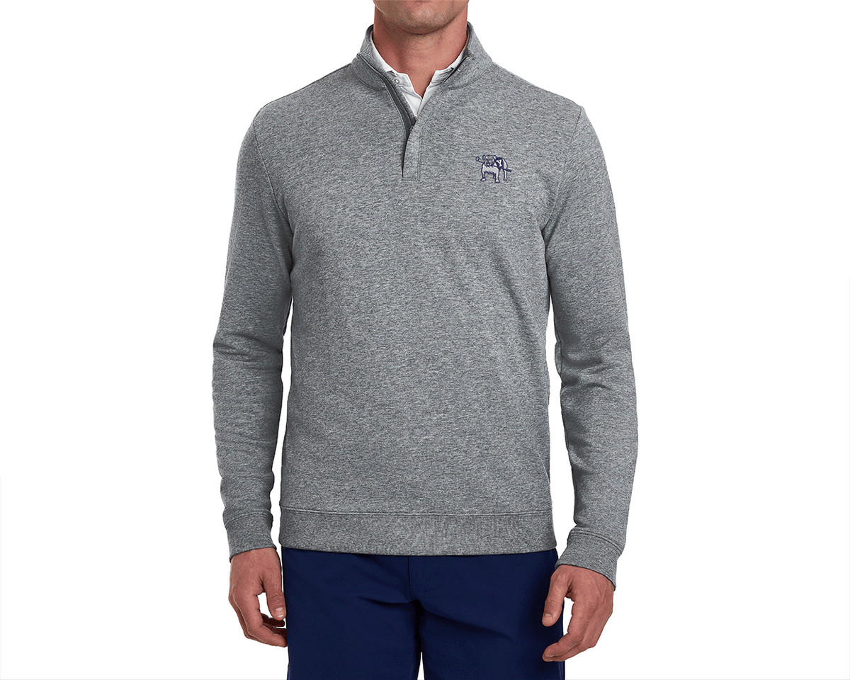 Male model wearing Yale Golf Course Harper Pullover: Heathered Gray, featuring a quarter-zip design with a bulldog logo, over a white shirt, paired with dark blue pants.