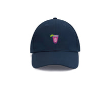 Navy transfusion golf hat with embroidered Holderness and Bourne pink cocktail logo.
