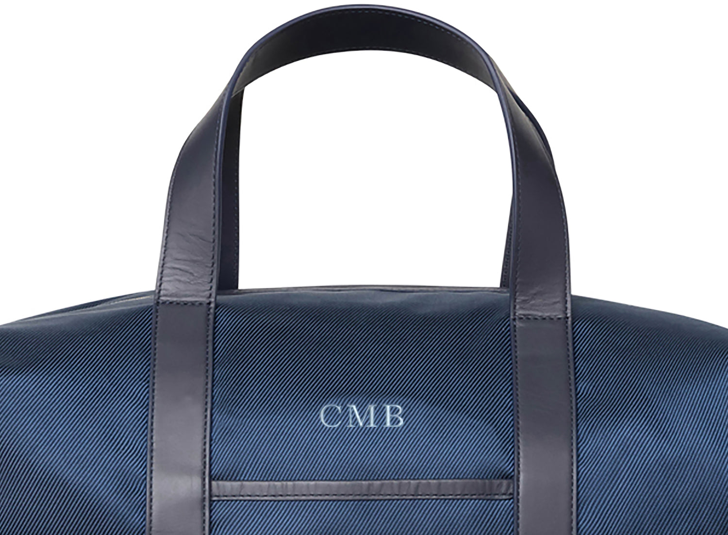 Navy blue duffle bag with dark leather straps and embroidered lettering from Holderness and Bourne.