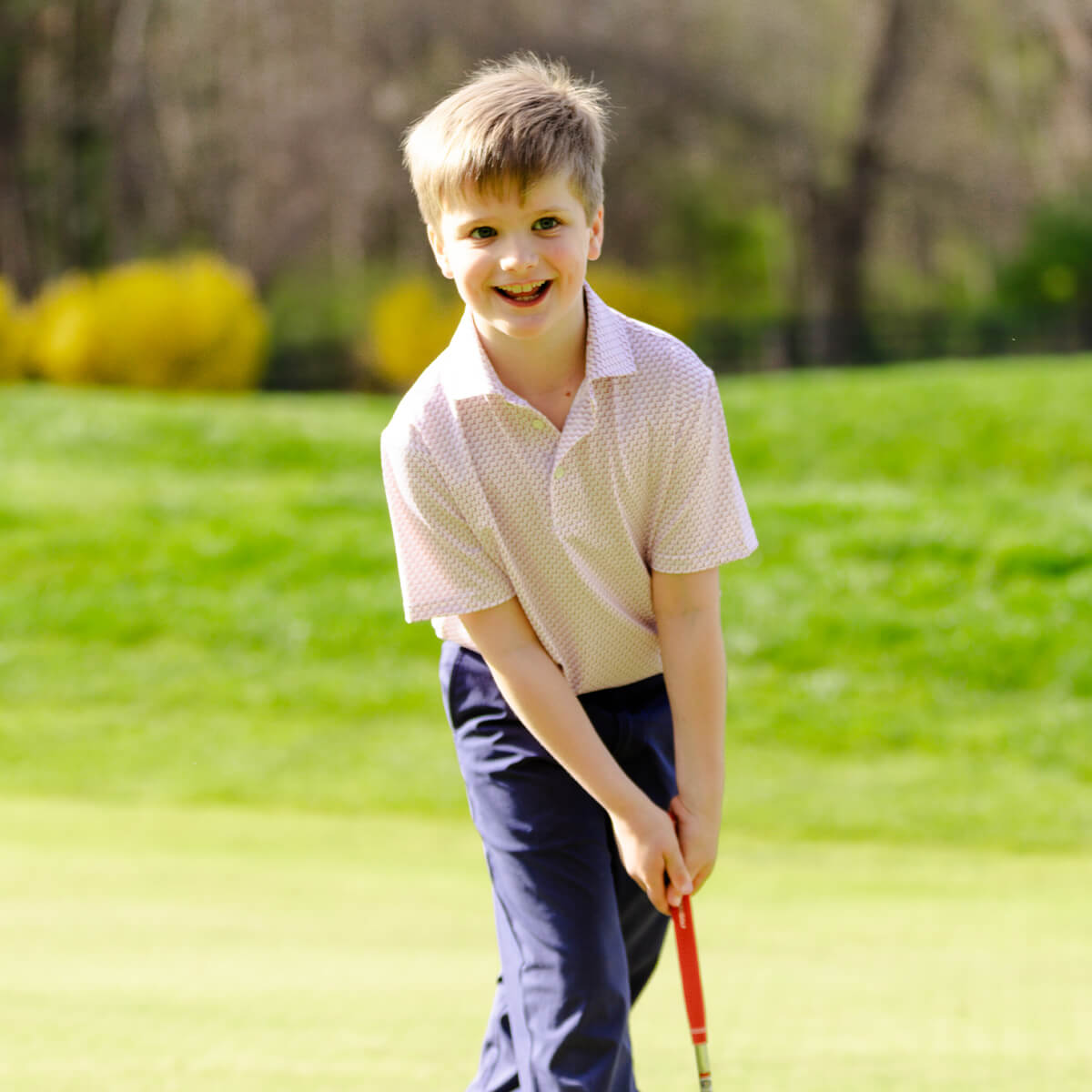 boy wearing golf clothes