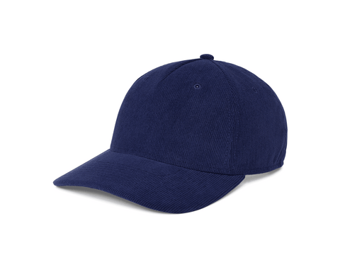 Angled side view of The Corduroy Hat: Navy, showing the ribbed corduroy crown, curved brim, and top button on the structured six-panel cap.