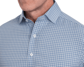Close-up of a blue checkered shirt with a collar