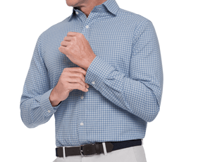 Man wearing a blue checkered shirt with rolled-up sleeves on a white background