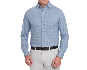 Man wearing a blue checkered button up shirt and gray pants on a white background