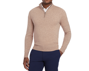 Man wearing Holderness & Bourne Men’s Tan Pullover Sweater and navy pants on a white background