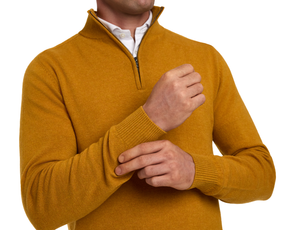 Man wearing Holderness & Bourne Men’s Golden Yellow Sweater with a white shirt underneath on a white background