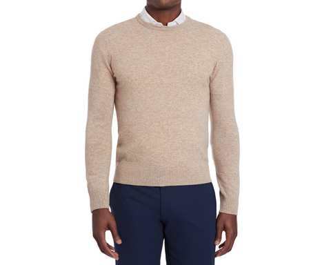 Man wearing Holderness & Bourne Men’s Beige Sweater and navy pants on a white background