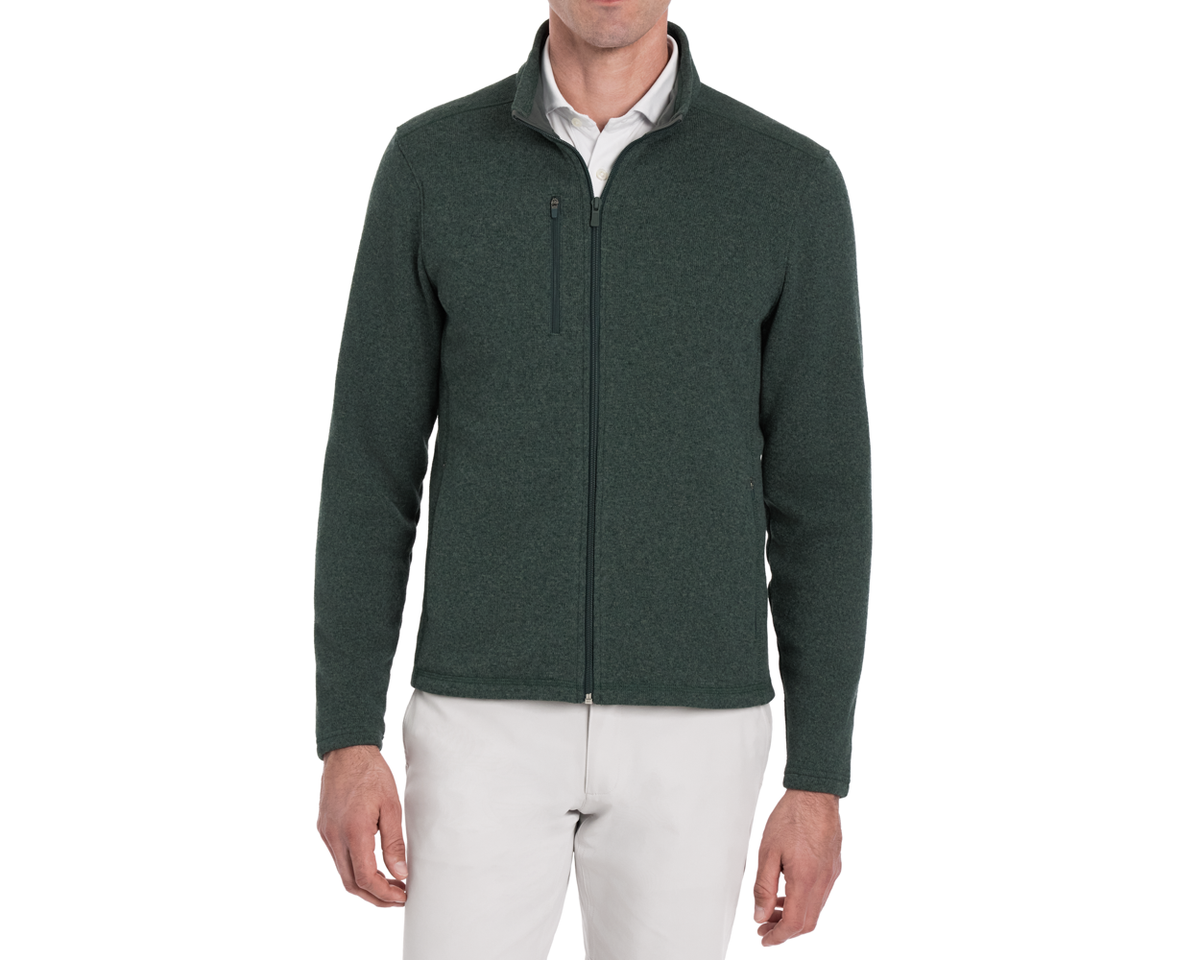 Man wearing a Holderness & Bourne Men’s Dark Green Fleece Jacket on a white background