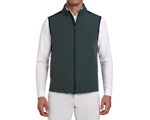 Man wearing a Holderness & Bourne Men’s Green Golf Vest over a white shirt on a white background