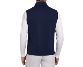 Back view of the 2026 U.S. Open Swenson Vest: Navy, featuring a sleeveless design over a white long-sleeve shirt, paired with light-gray pants.