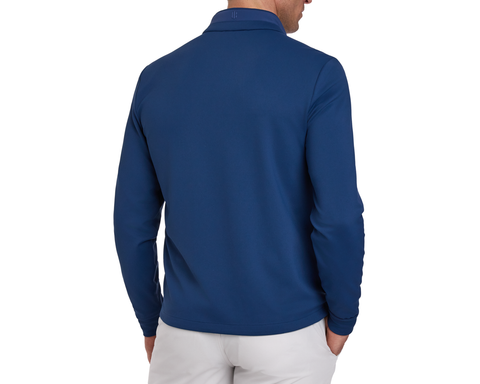 Person wearing a blue long-sleeve golf jacket on a white background