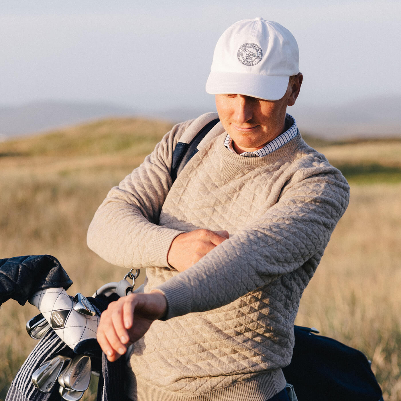 golf player wearing golf sweater