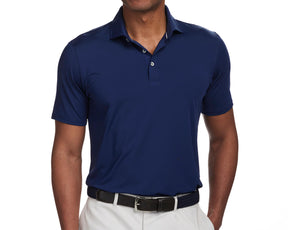 Front shot of Holderness and Bourne navy golf shirt modeled on man's torso.
