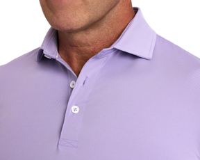 Close-up of The Anderson Shirt: Tudor, featuring a polo-style design with a two-button placket, structured spread collar, and visible stitching details.