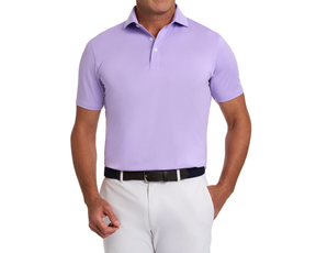 Man wearing The Anderson Shirt: Tudor, a short-sleeve polo with structured collar, paired with white trousers and a dark woven belt.