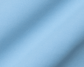 The Anderson Shirt: Vista Blue showcasing its light-blue woven fabric with diagonal ribbed texture, offering stretch, moisture wicking, and a soft drape.