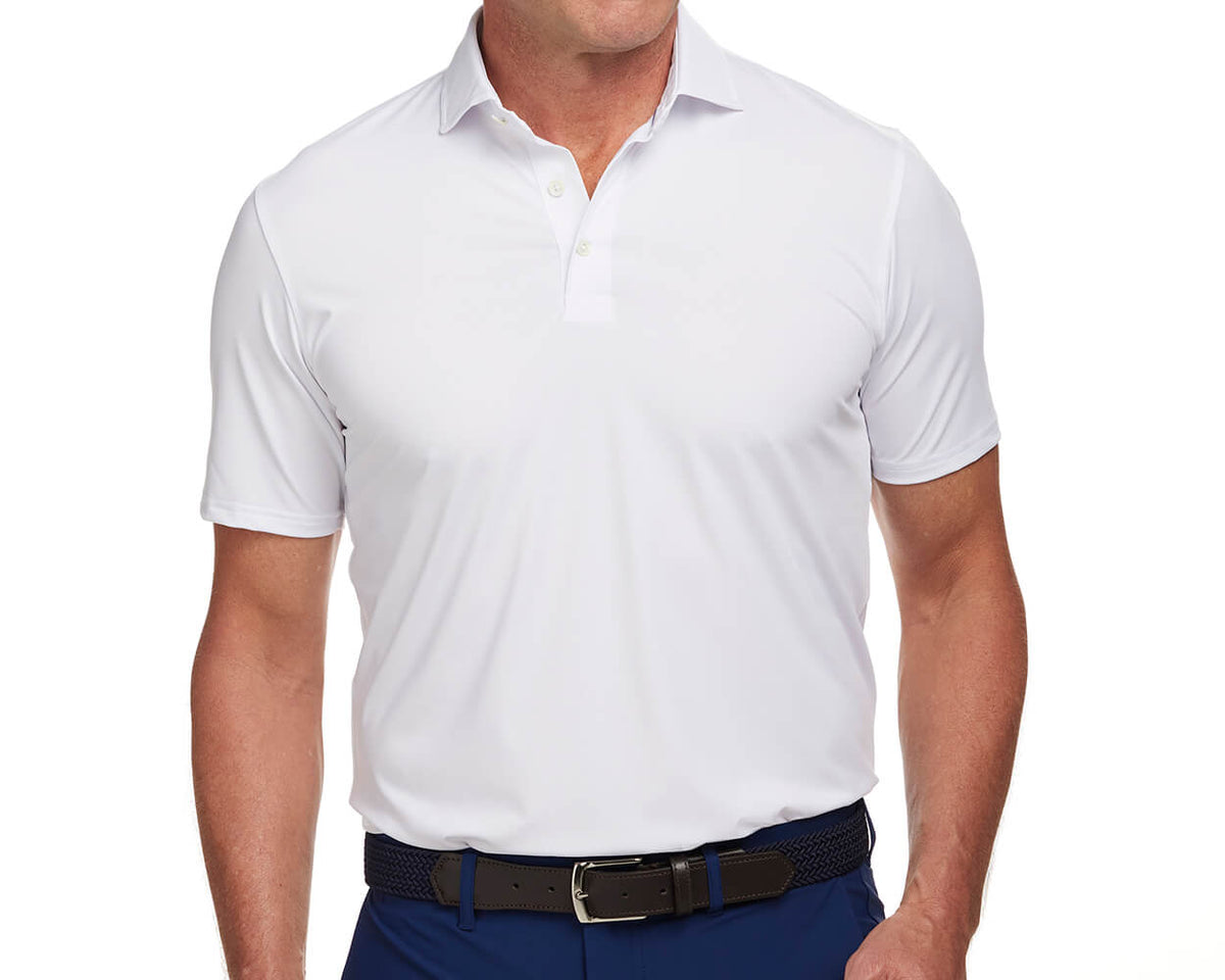 Front shot of Holderness and Bourne white golf shirt modeled on man's torso.