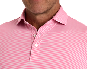 The Perkins Shirt: Belmont & White features a pink-and-white micro-striped pattern, structured collar, and fastened buttons, offering comfort with four-way stretch and moisture-wicking fabric.