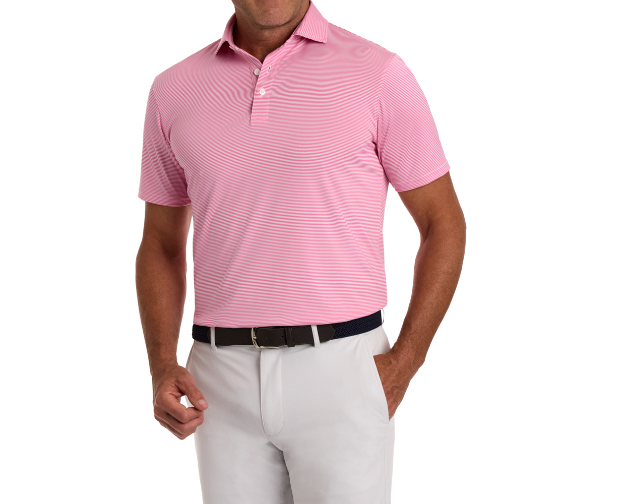 Male model wears The Perkins Shirt: Belmont & White, a light pink striped polo, tucked into light gray pants, with a dark belt, exemplifying casual elegance.