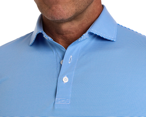 Man wearing The Perkins Shirt: Horizon Blue & White, showing a light-blue polo with fine white stripes, two-button placket, and classic collar.