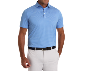 Man wearing The Perkins Shirt: Horizon Blue & White, featuring fine stripes, a structured collar, and tucked into light trousers with a woven belt.