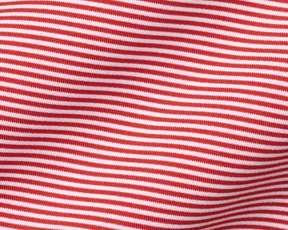 Close-up of The Perkins Shirt: Liberty Red & White, showcasing its fine knit, horizontal stripes, and gentle folds, highlighting its soft, performance fabric texture.