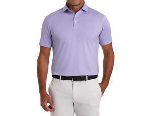 Man modeling The Perkins Shirt: Tudor & White, featuring fine stripes and structured collar, tucked into light trousers with a dark woven belt.
