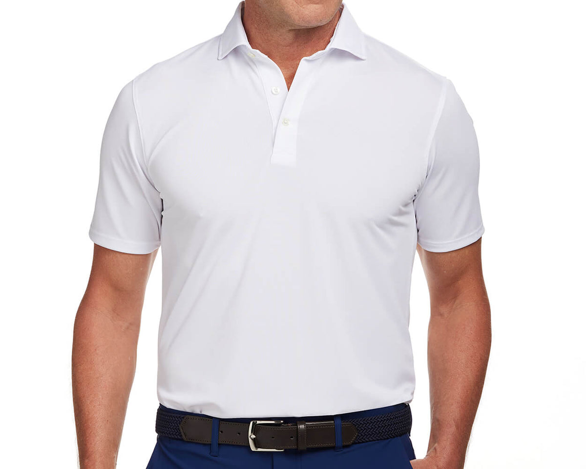 Front shot of Holderness and Bourne white golf polo modeled on man's torso. 
