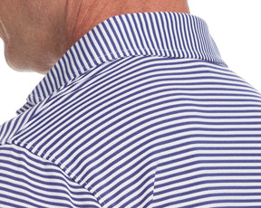 Close up shot the back of a blue stripe polo collar from Holderness and Bourne modeled on man.