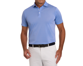 The Maxwell Shirt: Tudor & Vista Blue polo, featuring fine stripes, short sleeves, and a spread collar, paired with light trousers and a black belt.