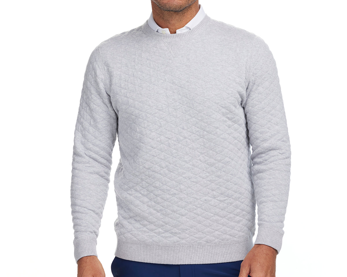 Front shot of Holderness and Bourne gray knit sweater modeled on man's torso.