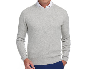 Front shot of Holderness and Bourne heathered sweater modeled on man's torso.
