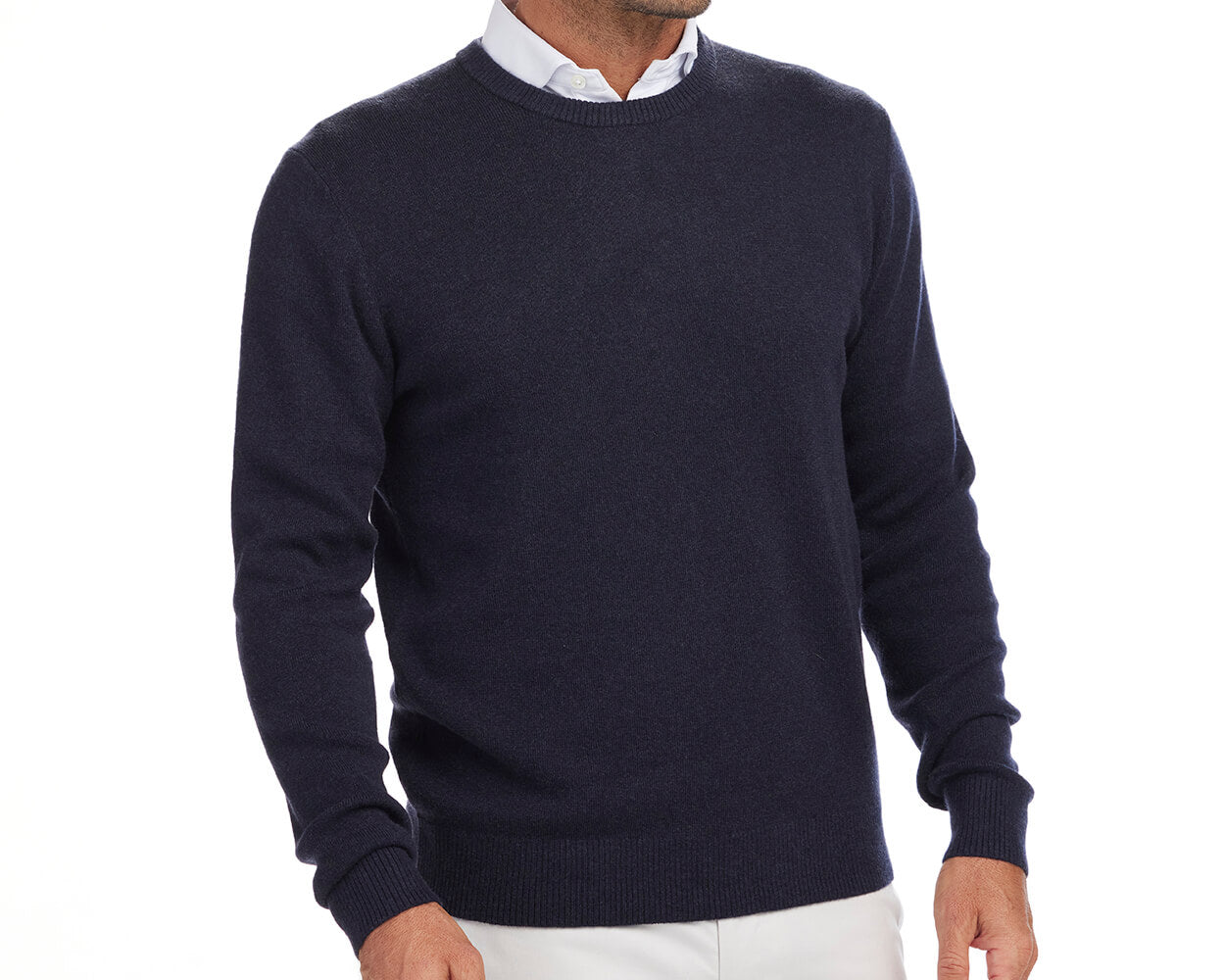 Front shot of Holderness and Bourne navy golf cashmere sweater modeled on man's torso.