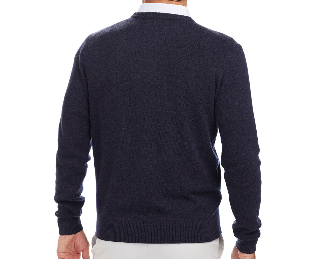 Back shot of Holderness and Bourne navy golf sweater modeled on man's torso.