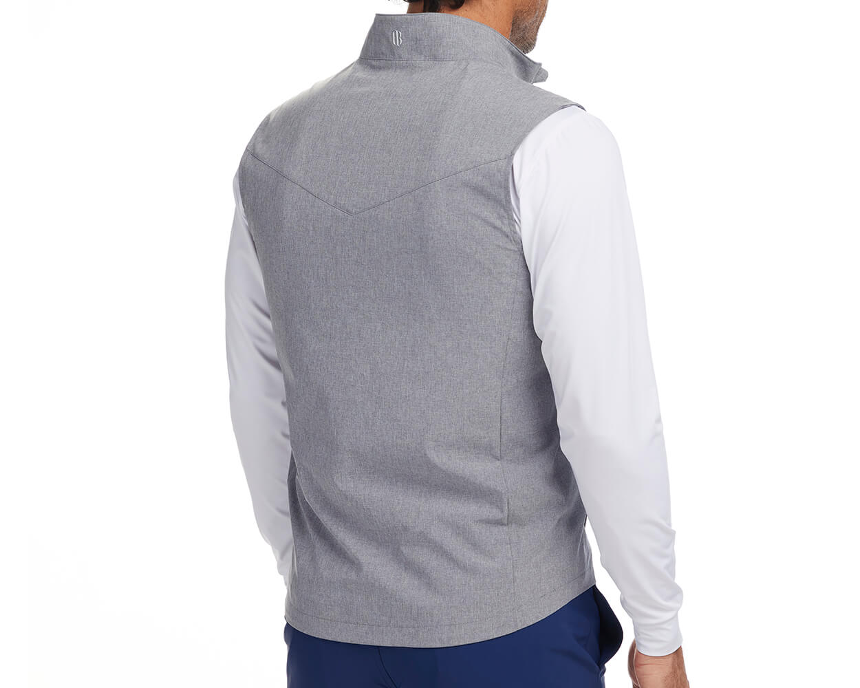 Back shot of Holderness and Bourne vest gray modeled on man's torso.