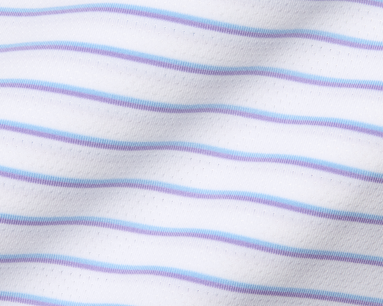 The Springer Shirt: White/Vista Blue/Tudor features ultra-breathable, perforated knit fabric with thin blue and lavender stripes, offering UPF 50+ protection and moisture wicking.