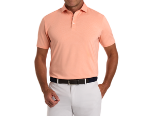 Man wearing The Holland Shirt: Heathered Nectarine, a short-sleeve polo with subtle stripes, paired with light trousers and a dark belt.