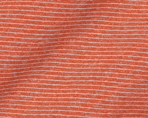 Close-up of Holderness & Bourne Men’s Orange Polo Shirt textured fabric andsubtle pattern 