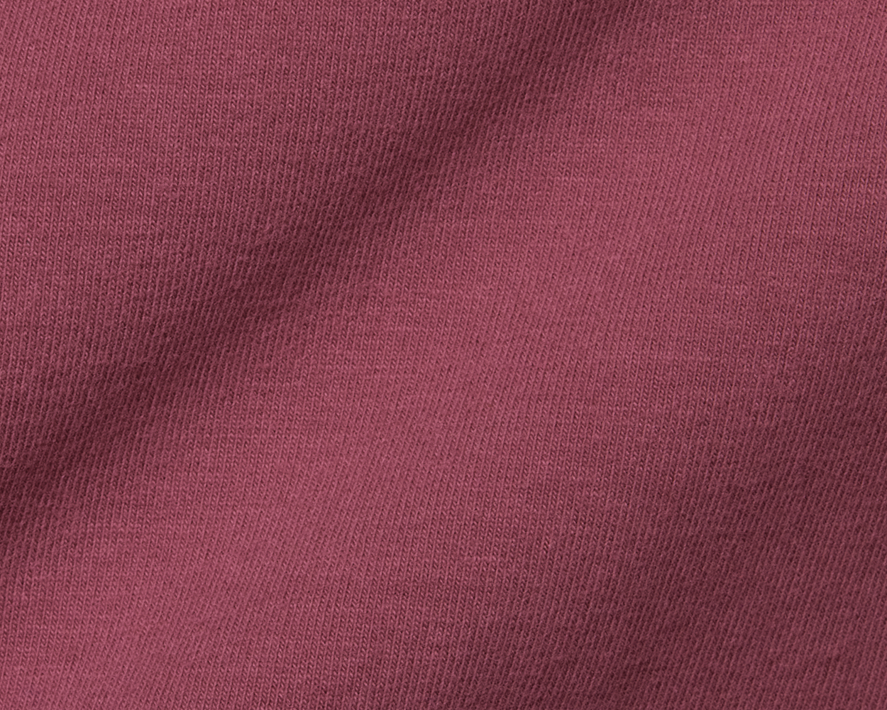 Close-up of The Mason T-Shirt: Cabernet, showcasing its fine knit texture made from luxurious Peruvian pima cotton, highlighting comfort, style, and durability.