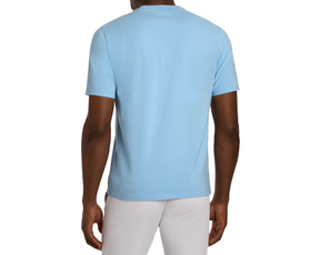 Back view of The Mason T-Shirt: Vista Blue, showcasing its classic short-sleeve design in Peruvian pima cotton, worn with light trousers against a white background.