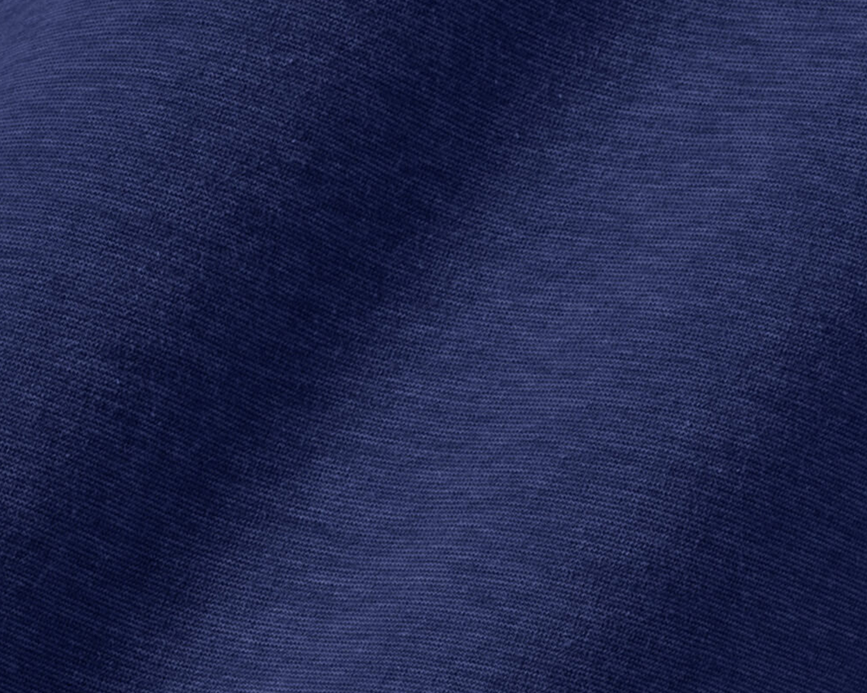 Close-up of the 2026 U.S. Open Mason T-Shirt: Navy, showcasing the fine knit weave of midweight Peruvian pima cotton fabric for comfort and durability.