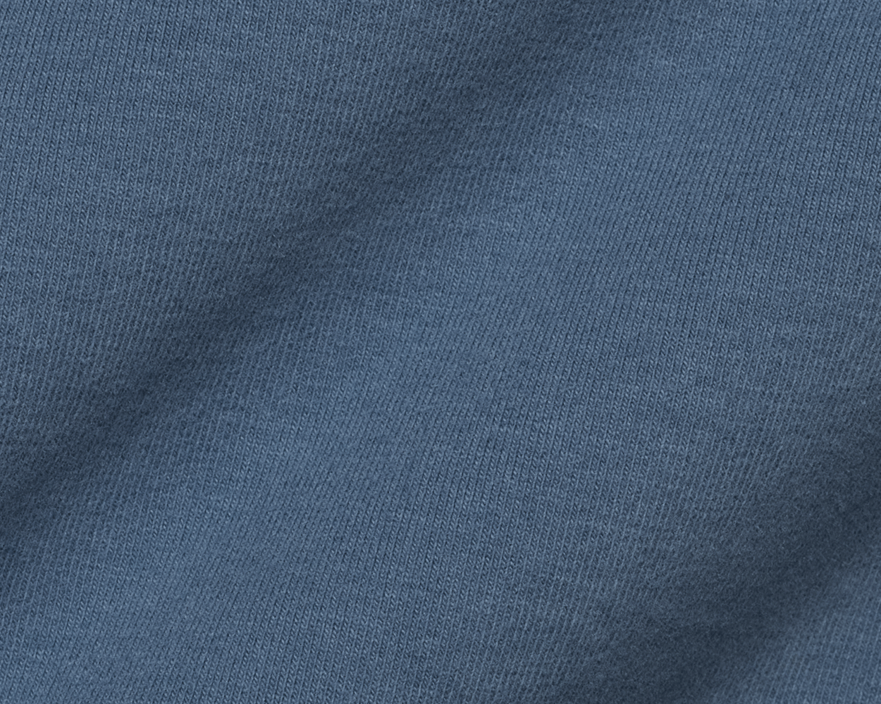 Close-up of the fine knit texture of The Montague Long Sleeve T-Shirt: Pacific Blue, showing the soft, even weave of the Peruvian Pima cotton blend fabric.