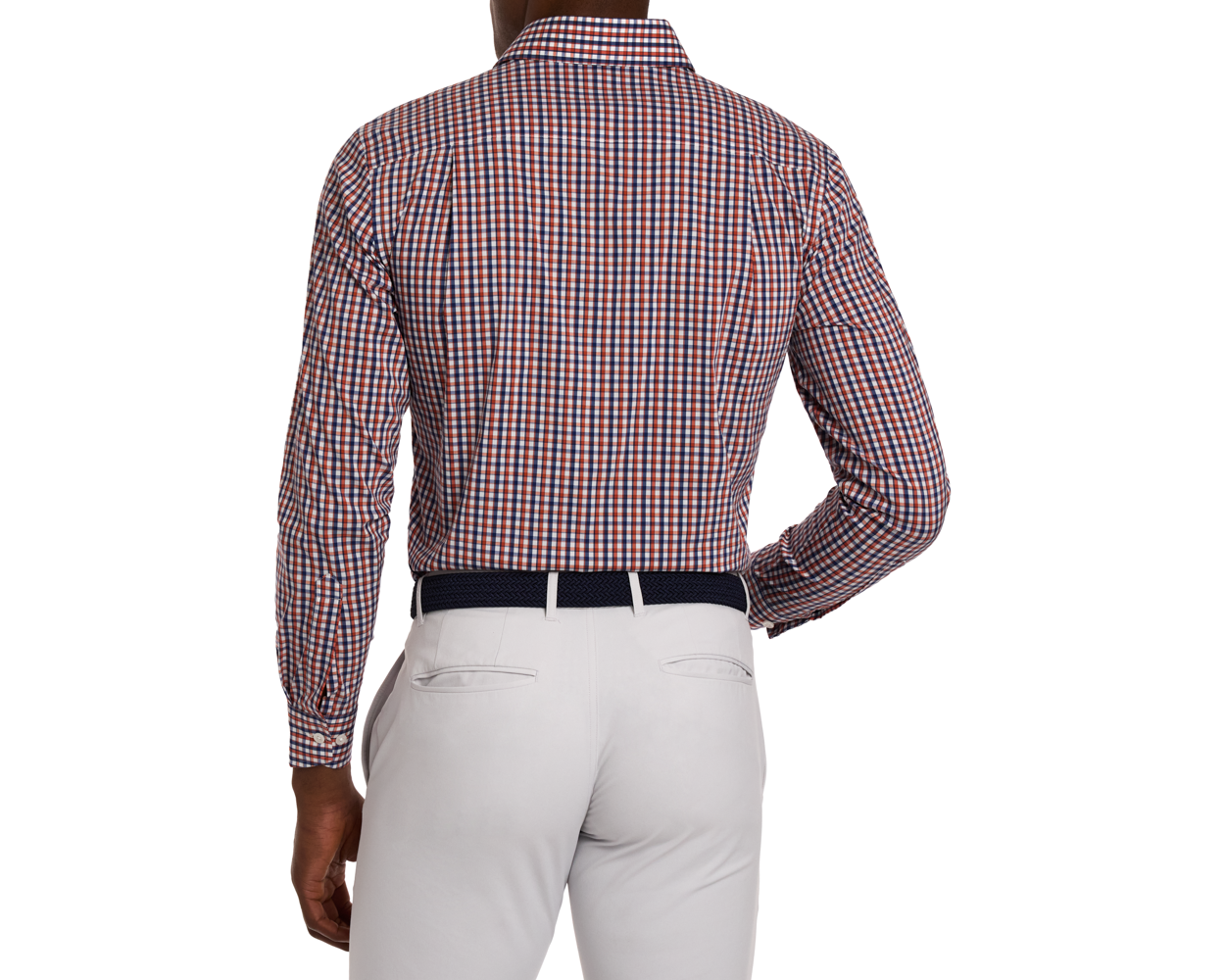 Man wearing a green and blue checkered shirt with white pants on a white background